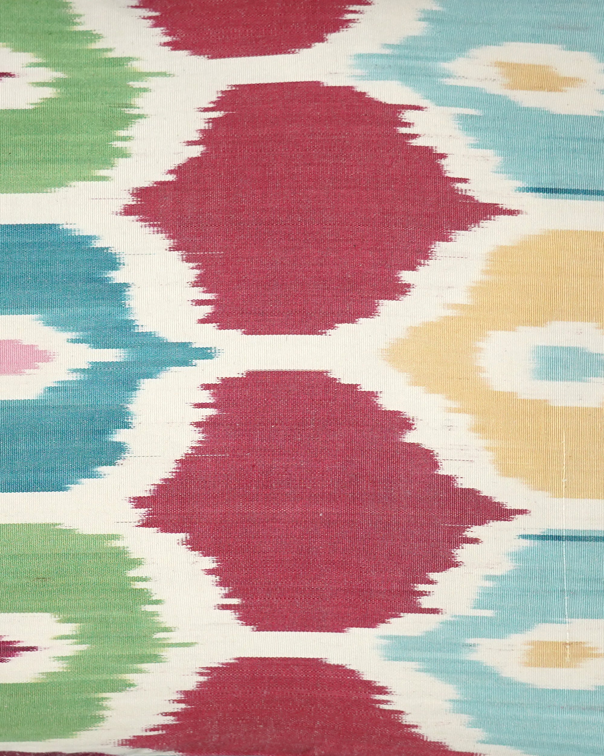 Close up detail of the multicoloured ikat cushion