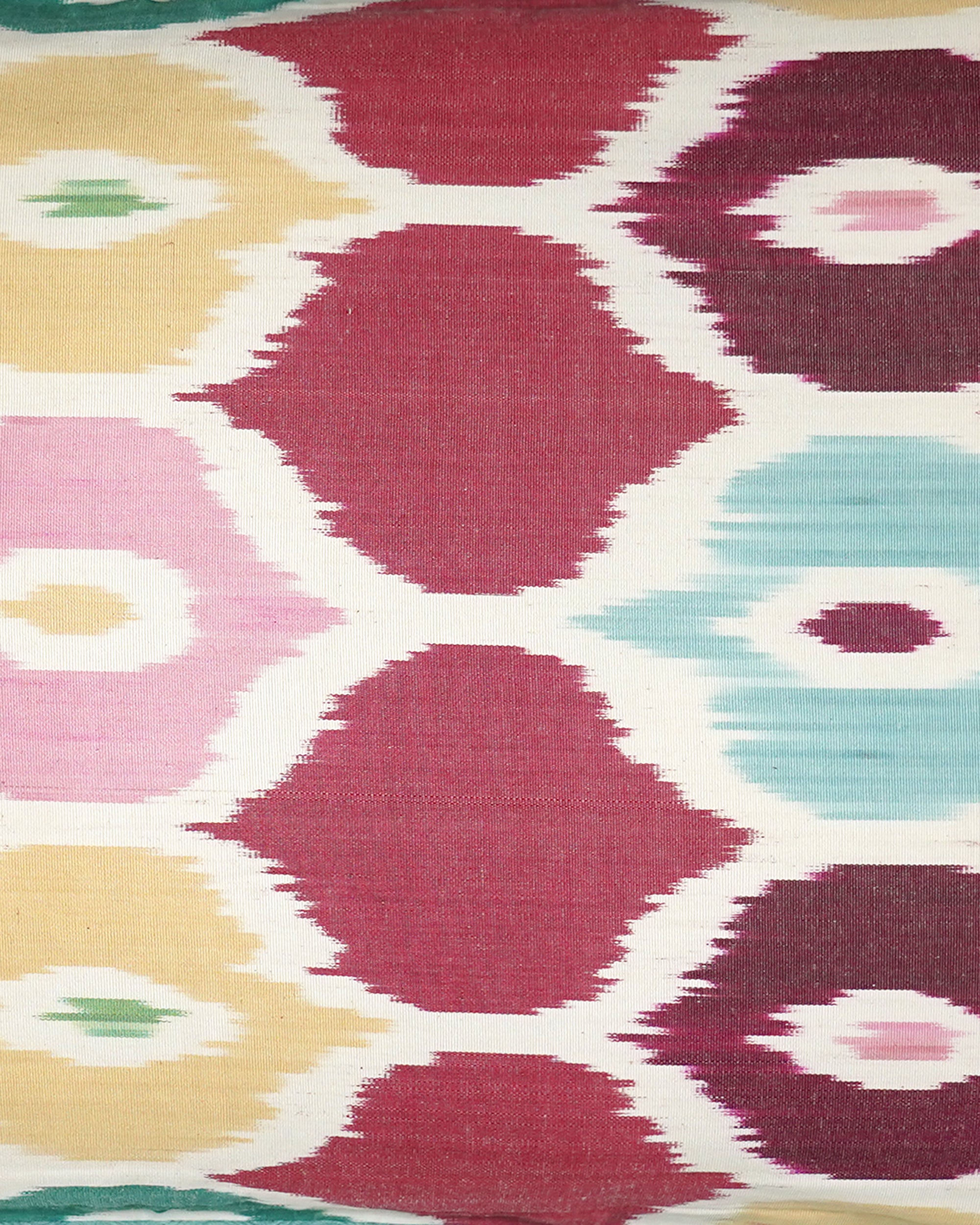 Close-up of a colorful geometric patterned ikat fabric.