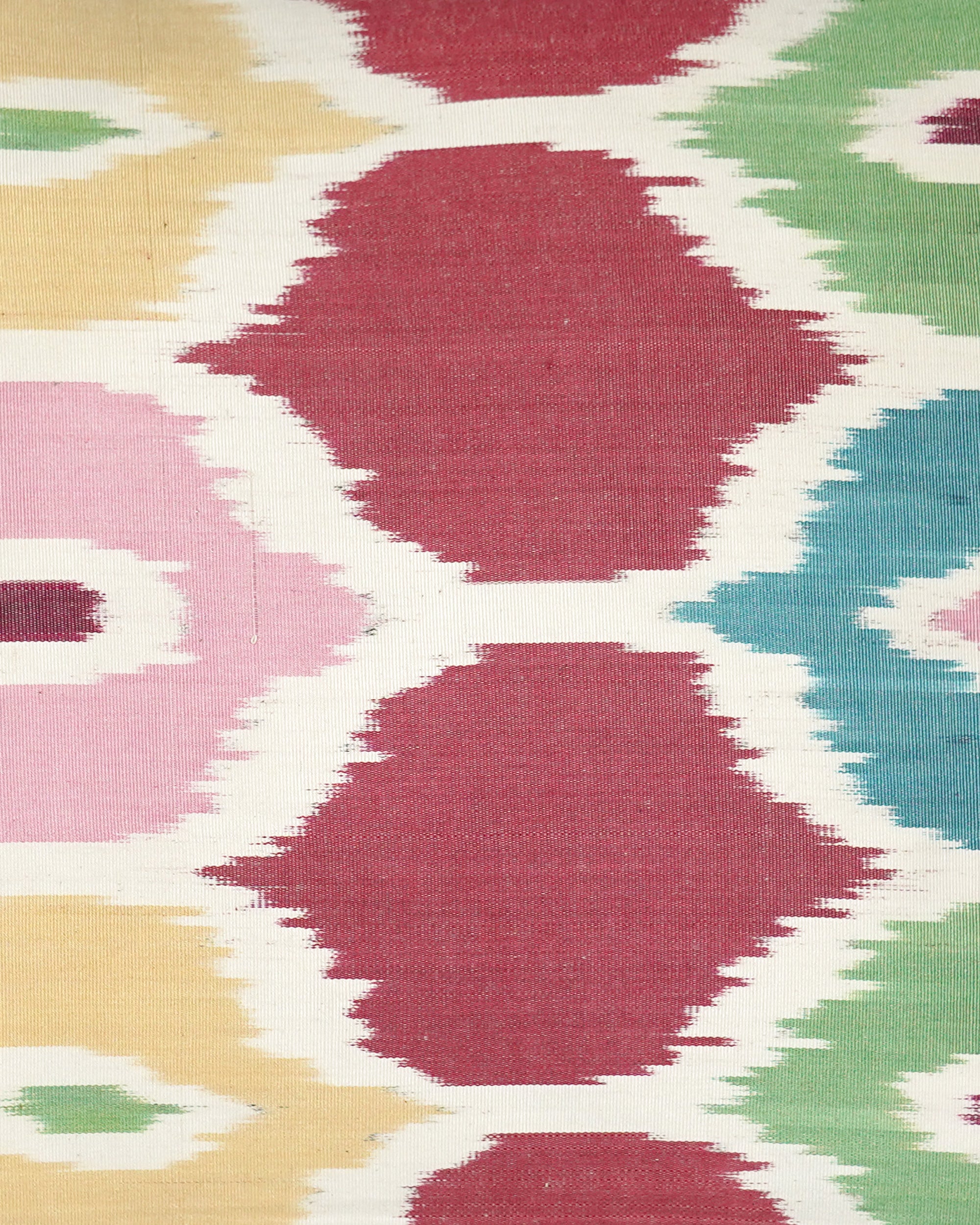 Close-up of a colorful Ikat cushion with geometric pattern