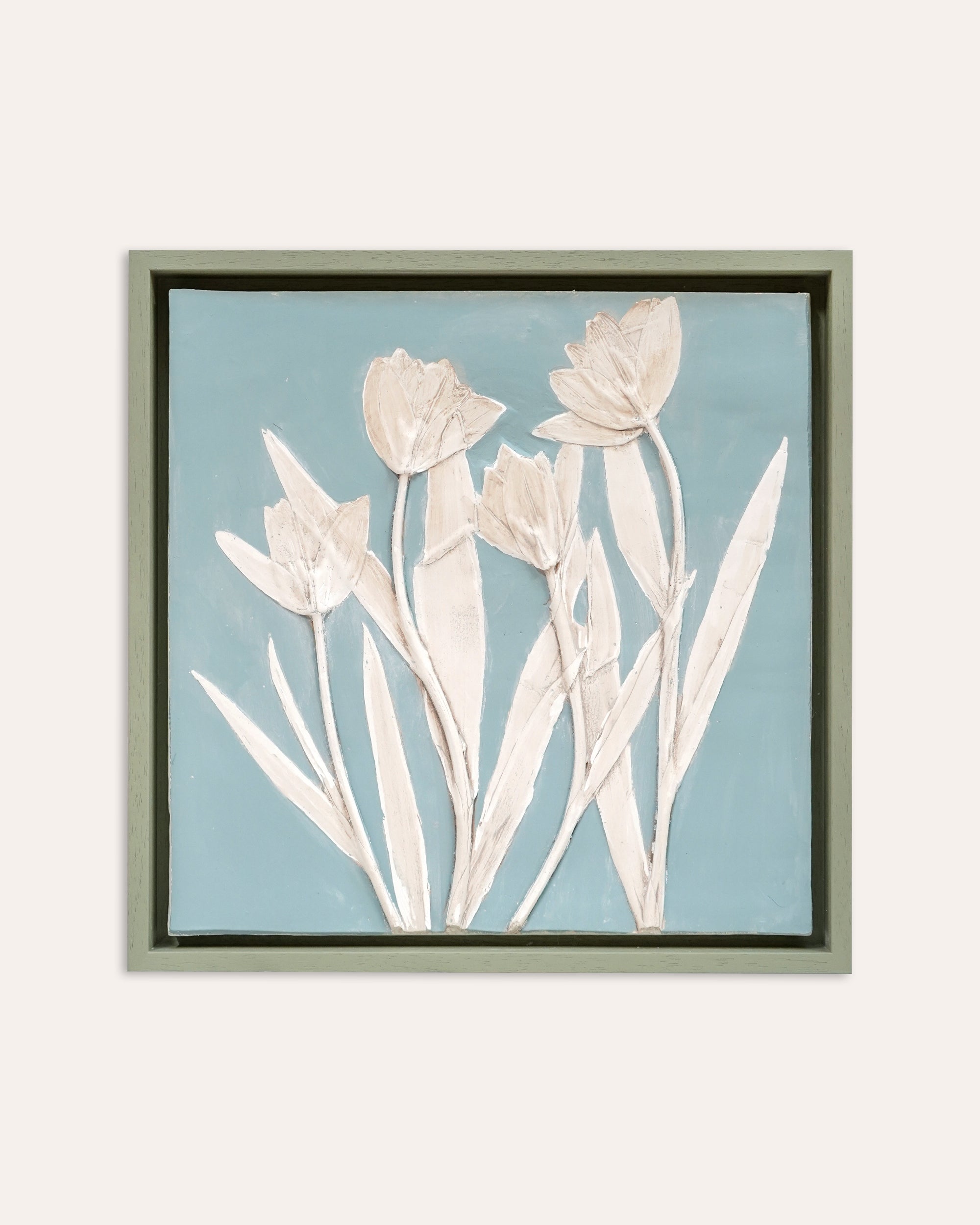 Framed artwork by Imprint Casts of white tulips on a light blue background