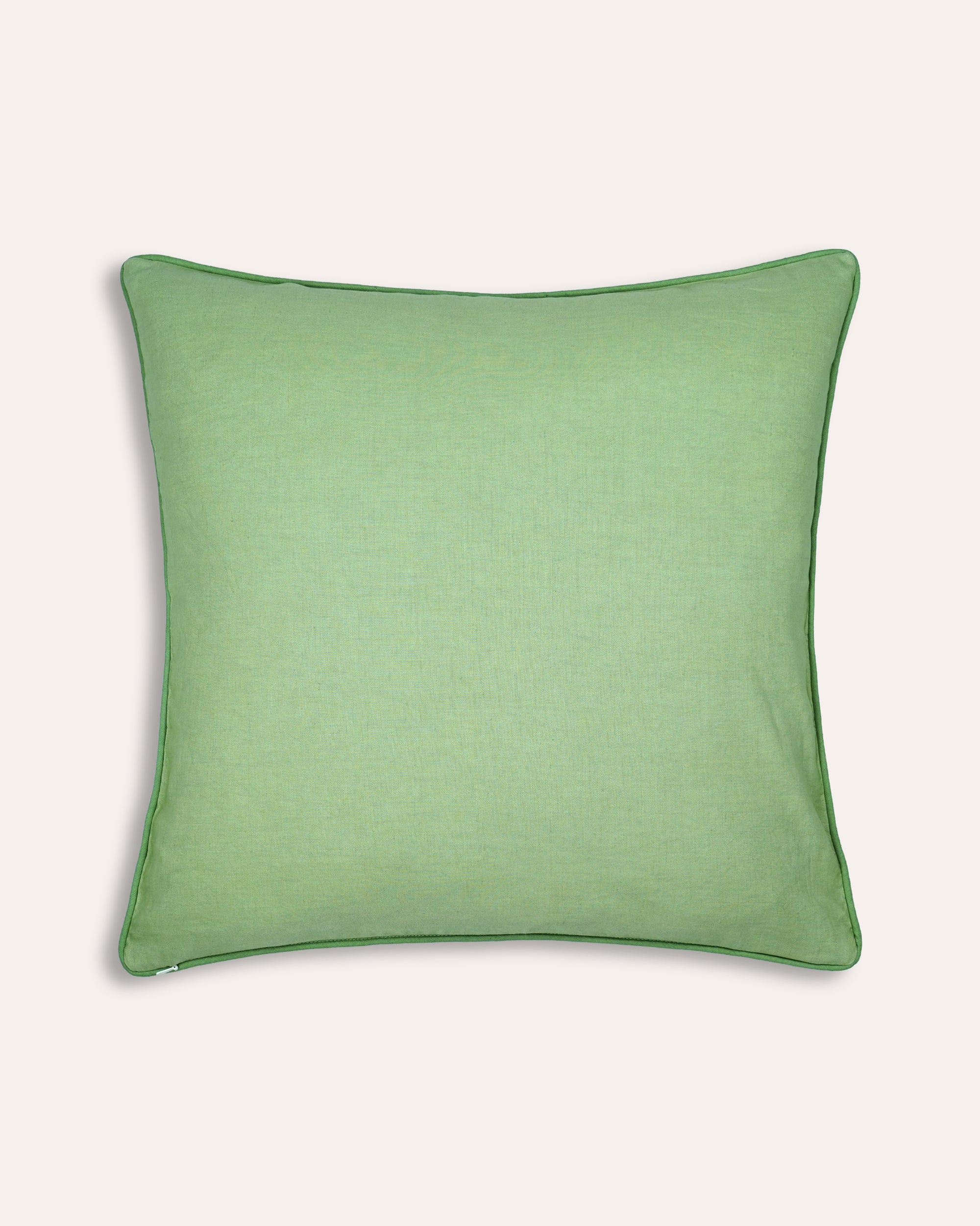 Green square cushion back on a taupe background