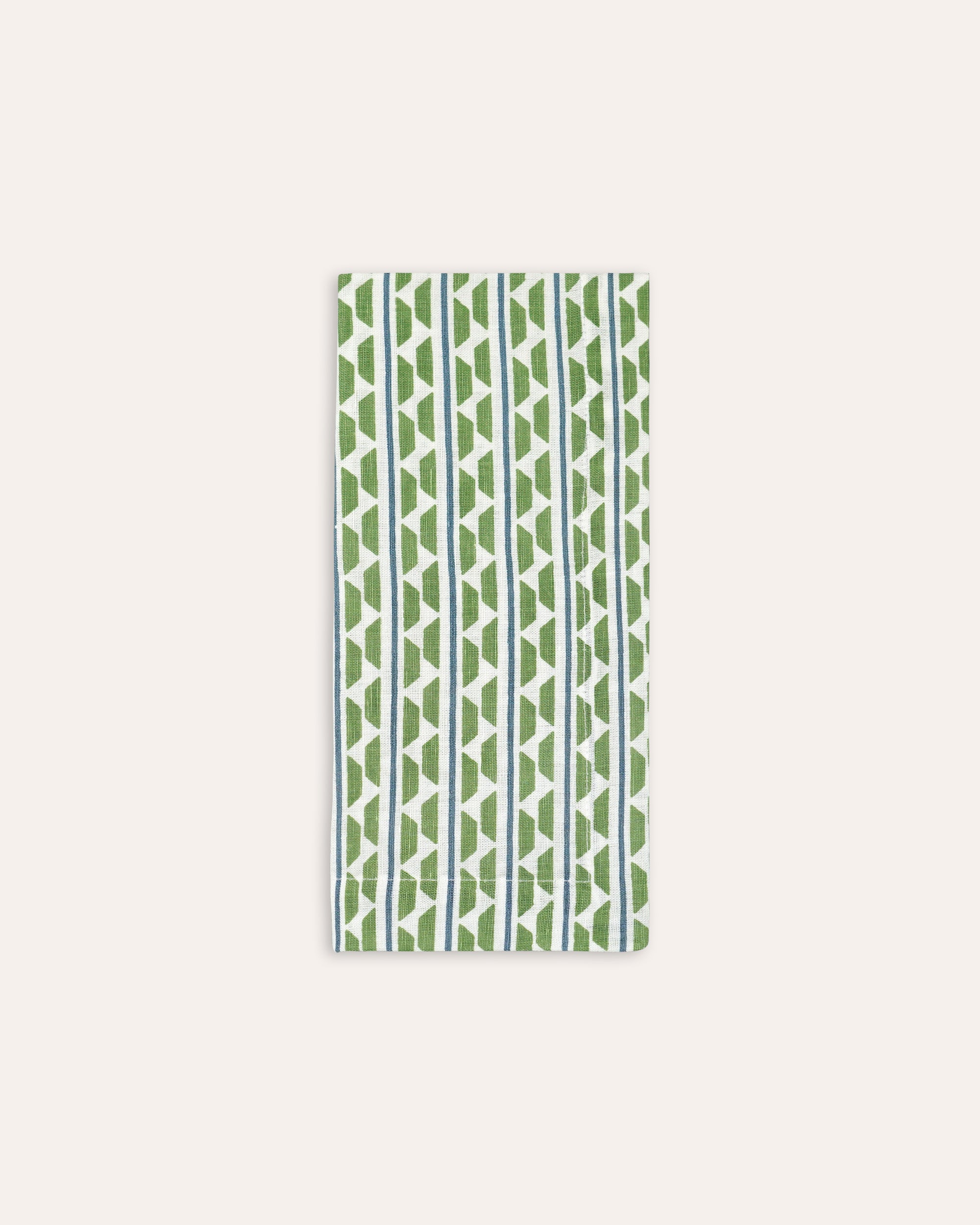 Rectangular napkin with green and blue geometric pattern on a white background