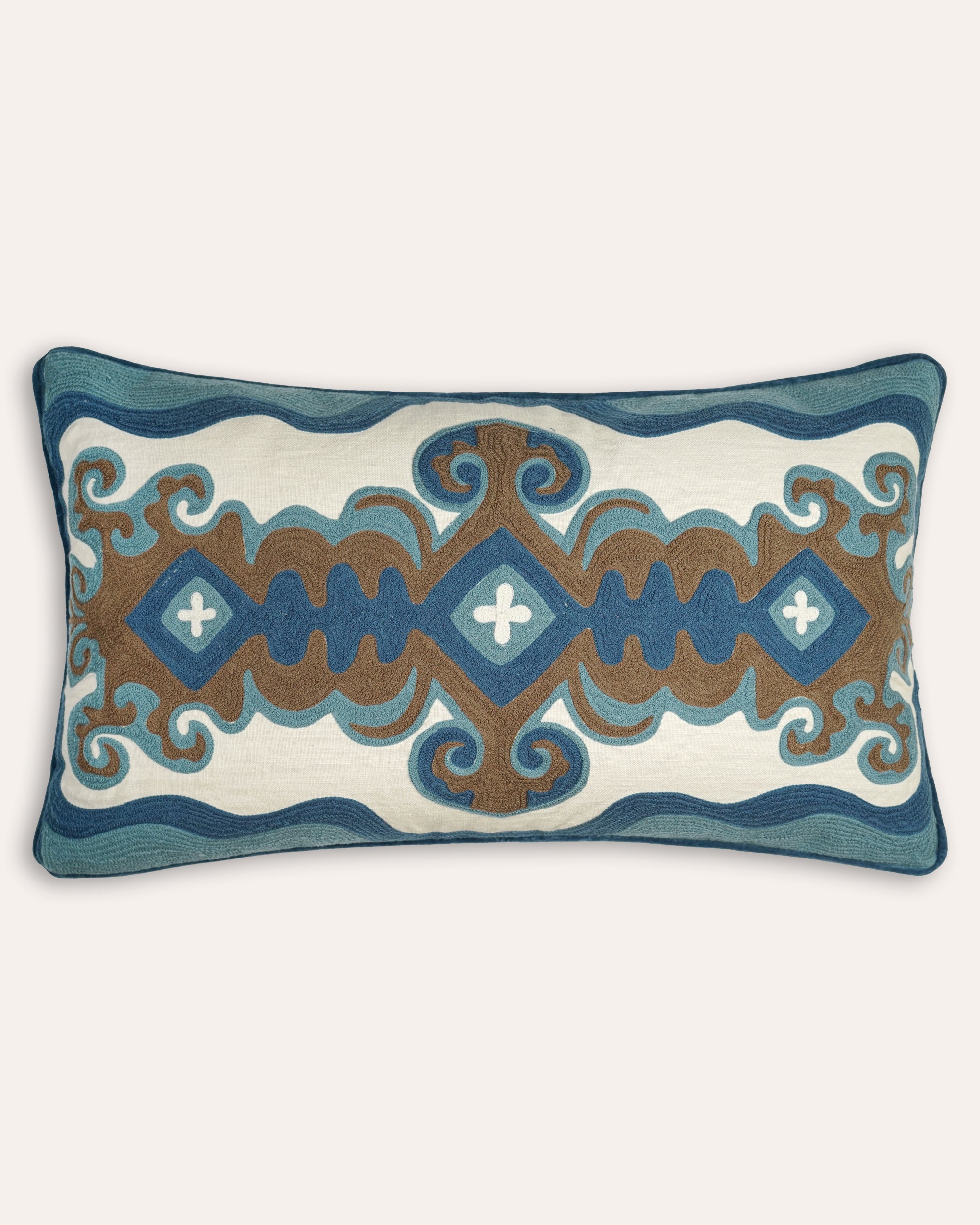 Decorative cushion with blue and brown pattern on a white background