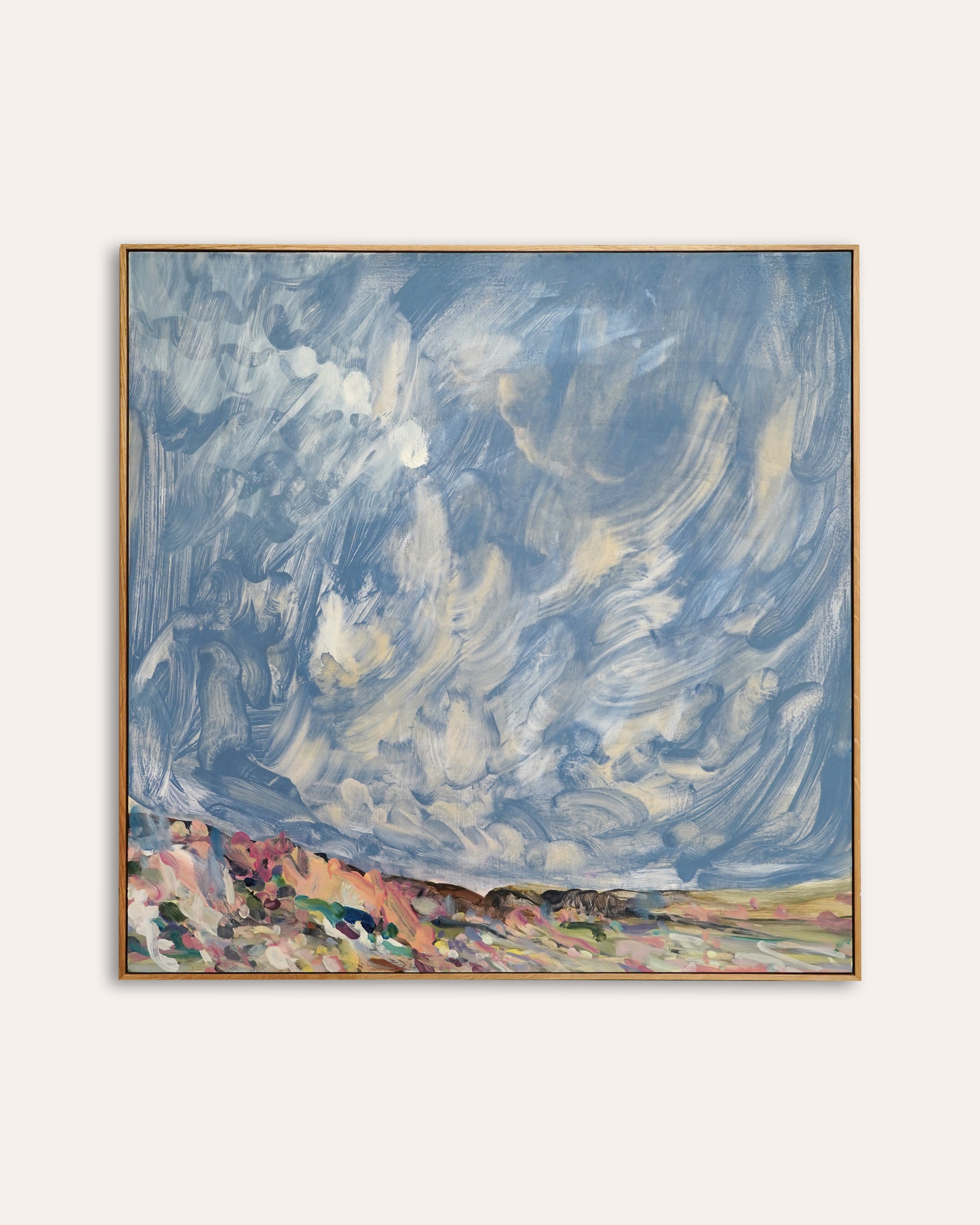 Abstract painting with swirling blue and white sky and colorful landscape below on a light gray background