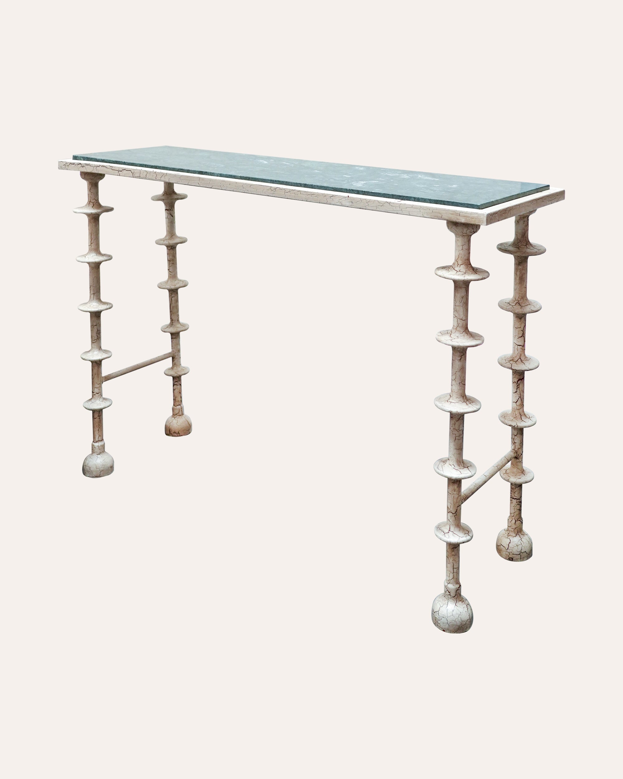 Console table with unique base design on a white background
