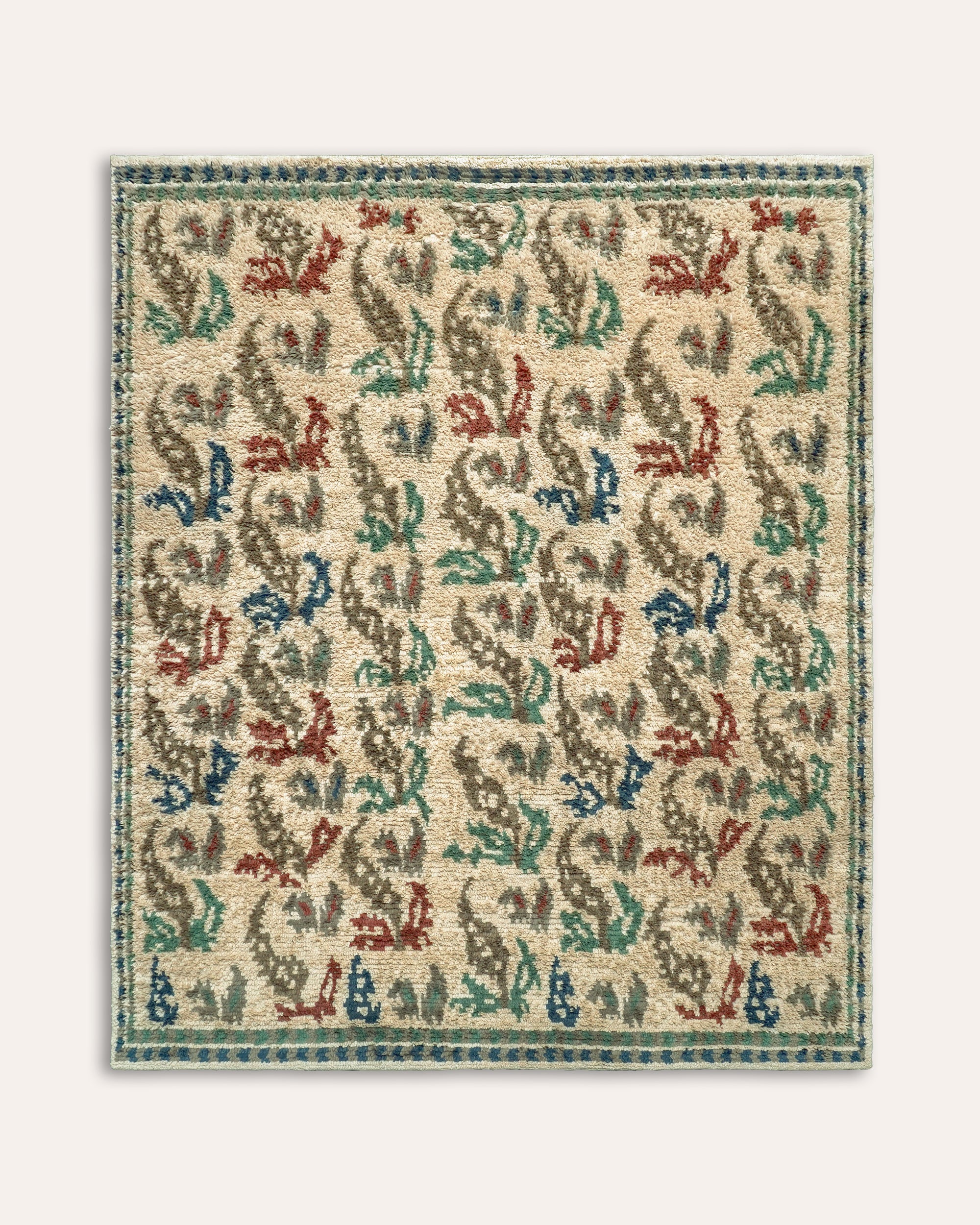 Decorative rug with a multicolored pattern on a plain background