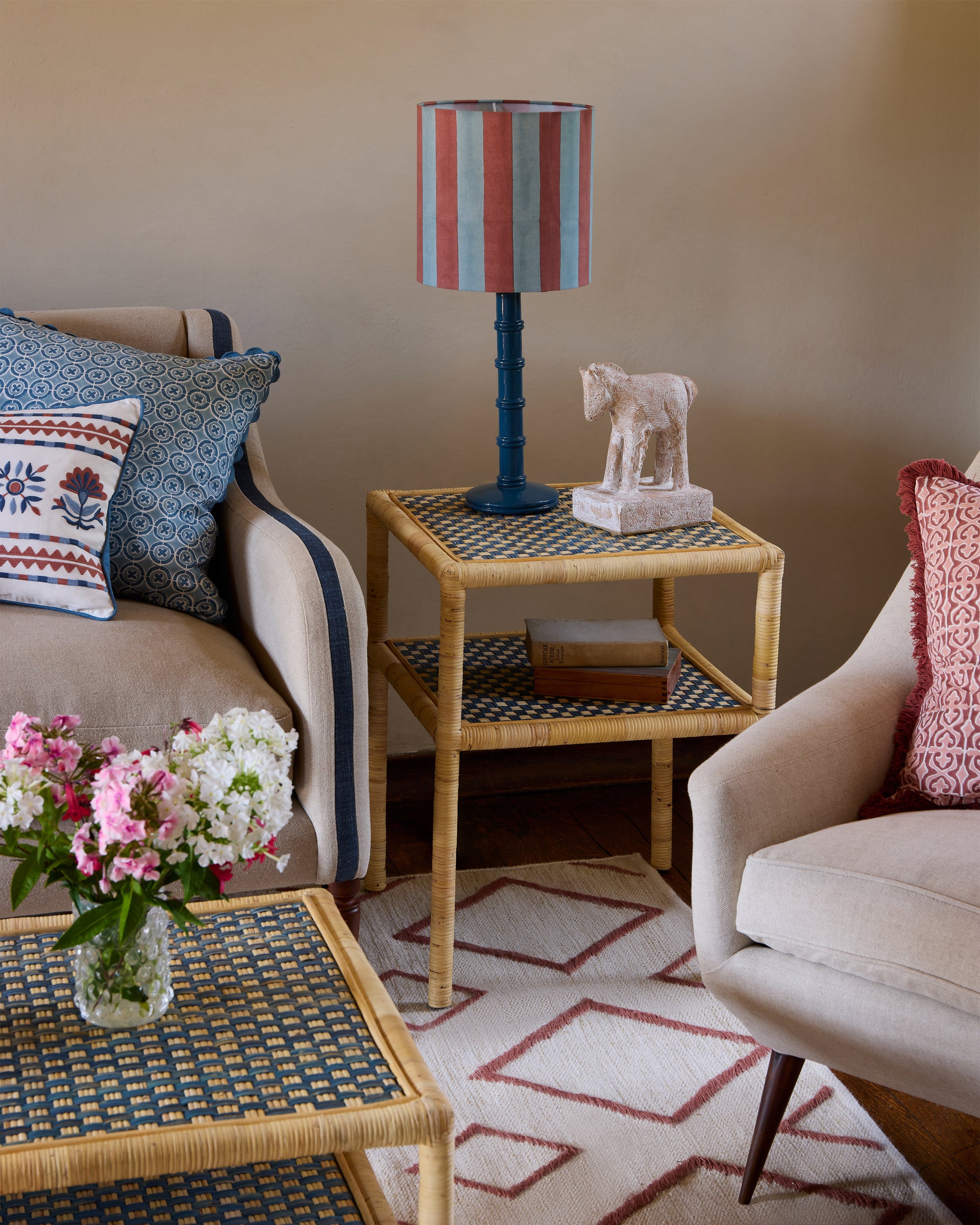 Blue Rattan side table in a blue and pink sitting room