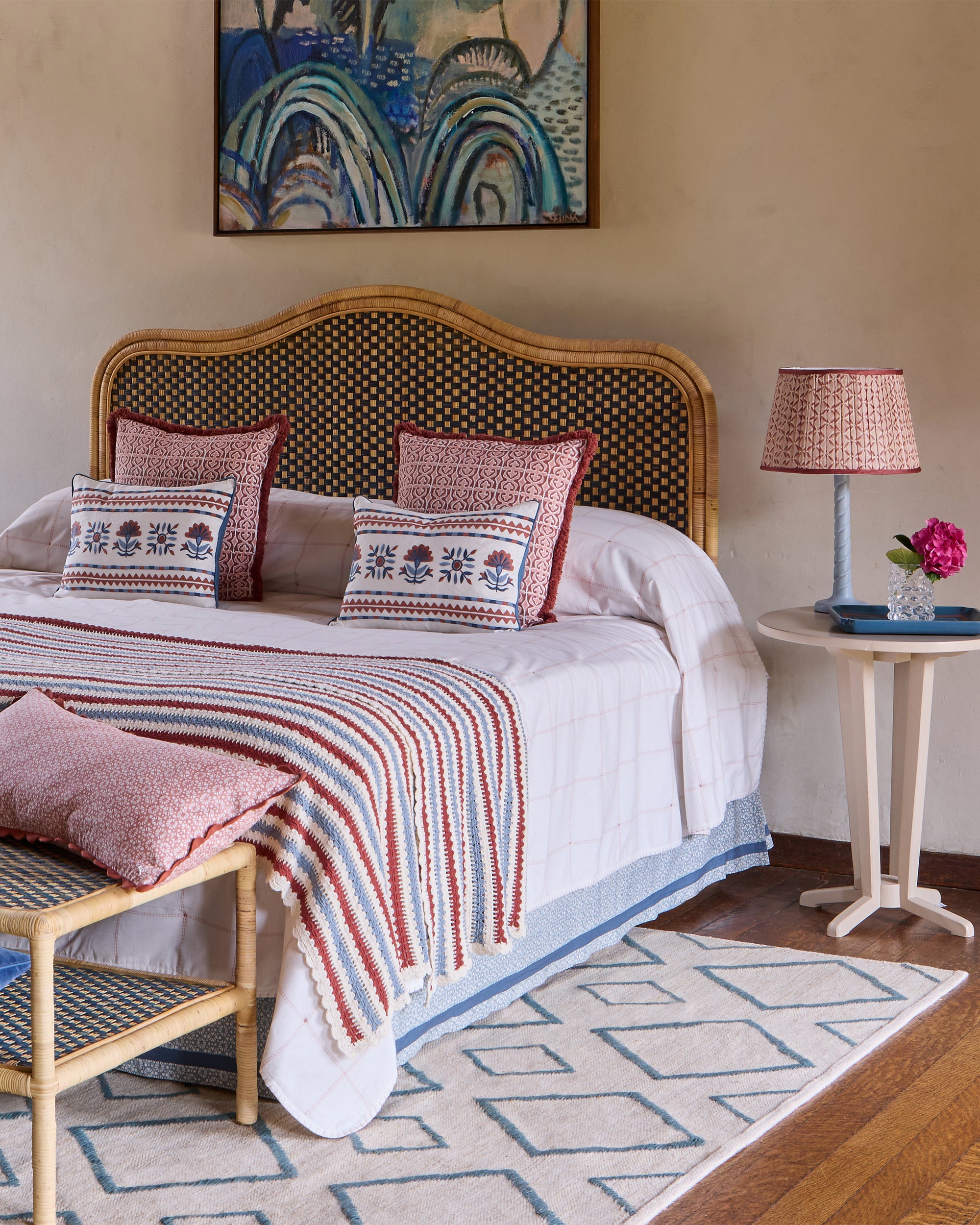 Pink and blue bedroom featuring Birdie Fortescue's spring summer soft furnishings