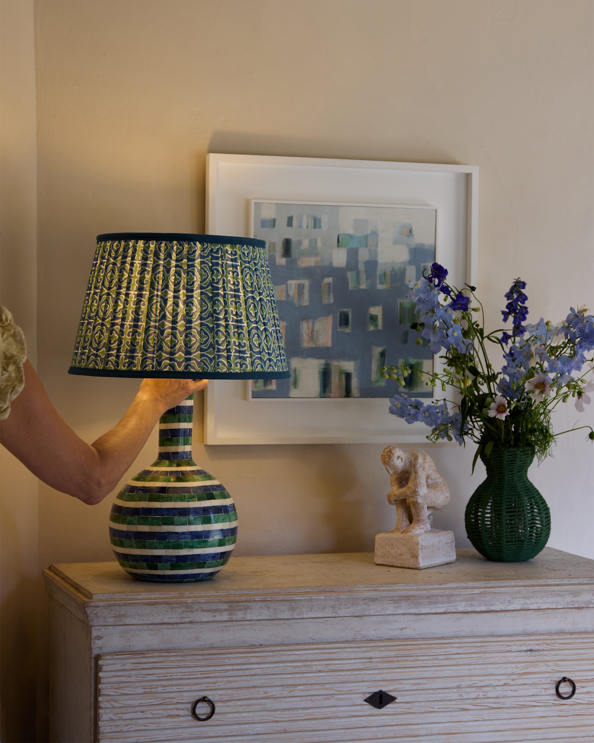 Birdie Fortescues antique chester drawers, with the spring summer raya inlay lamp and blue and green Santa Clara lampshade