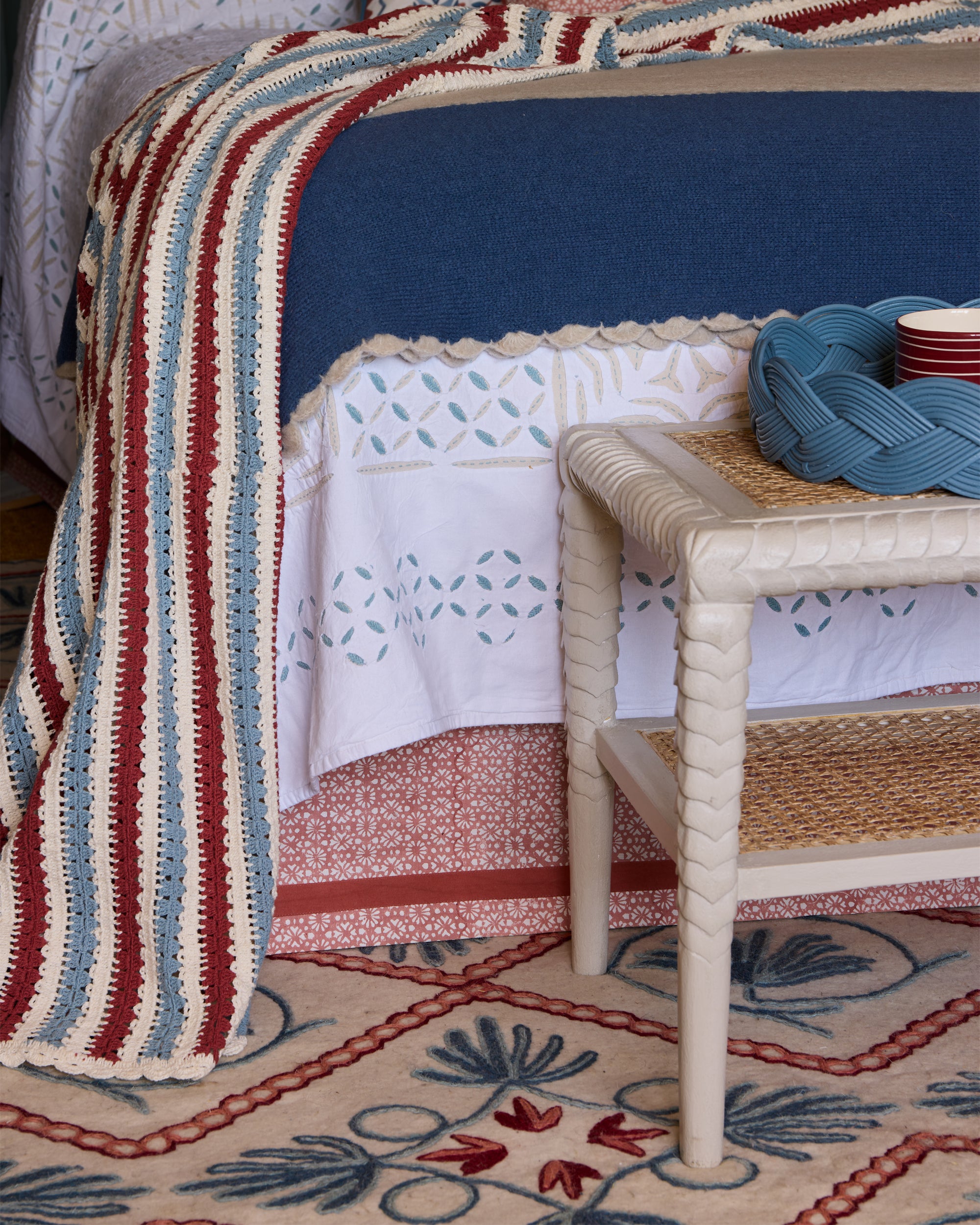 Close up detail shot of blue and red bedroom with Birdie Fortescue's furnishings