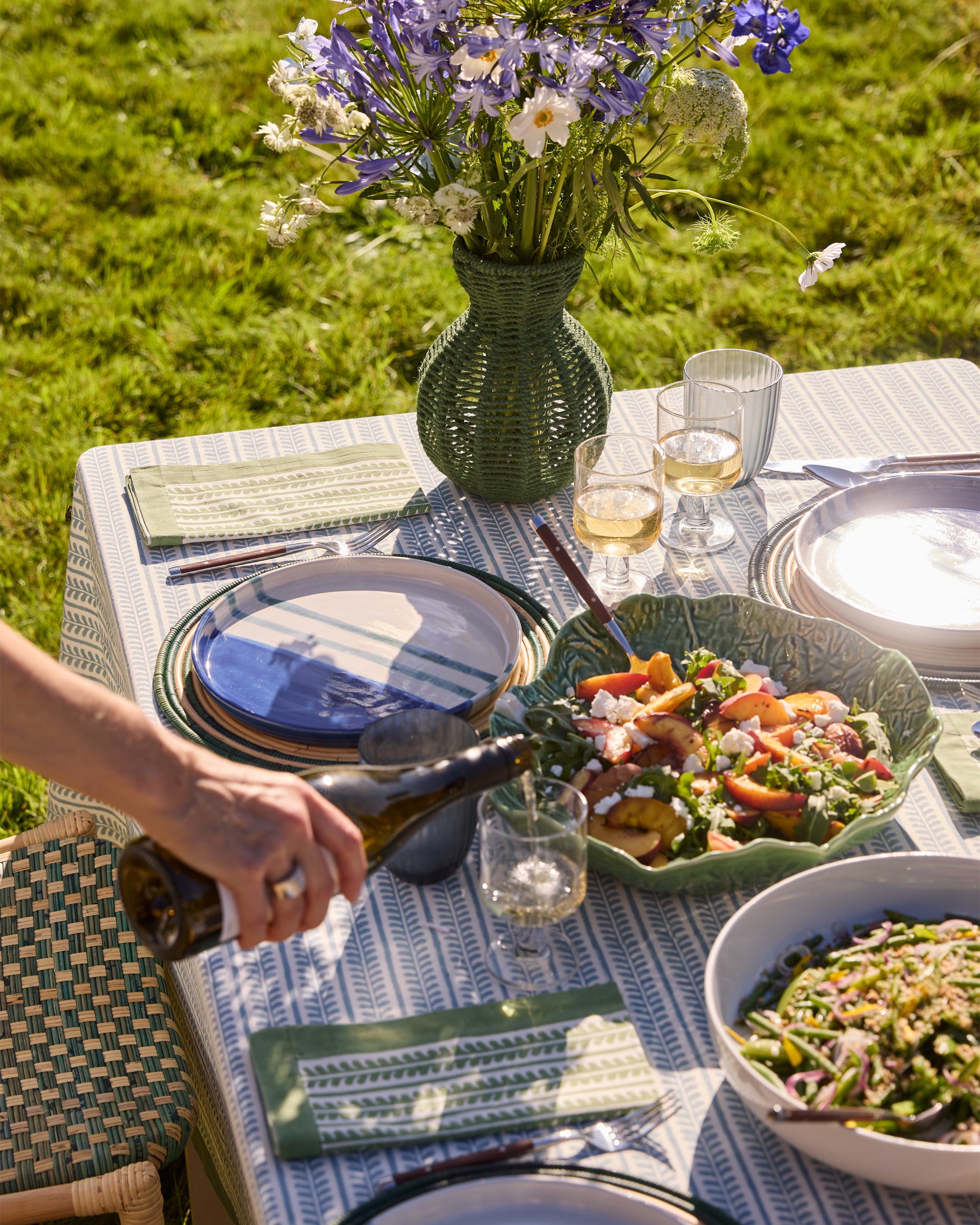 Outdoor spring summer dining image featuring our green string jute vase