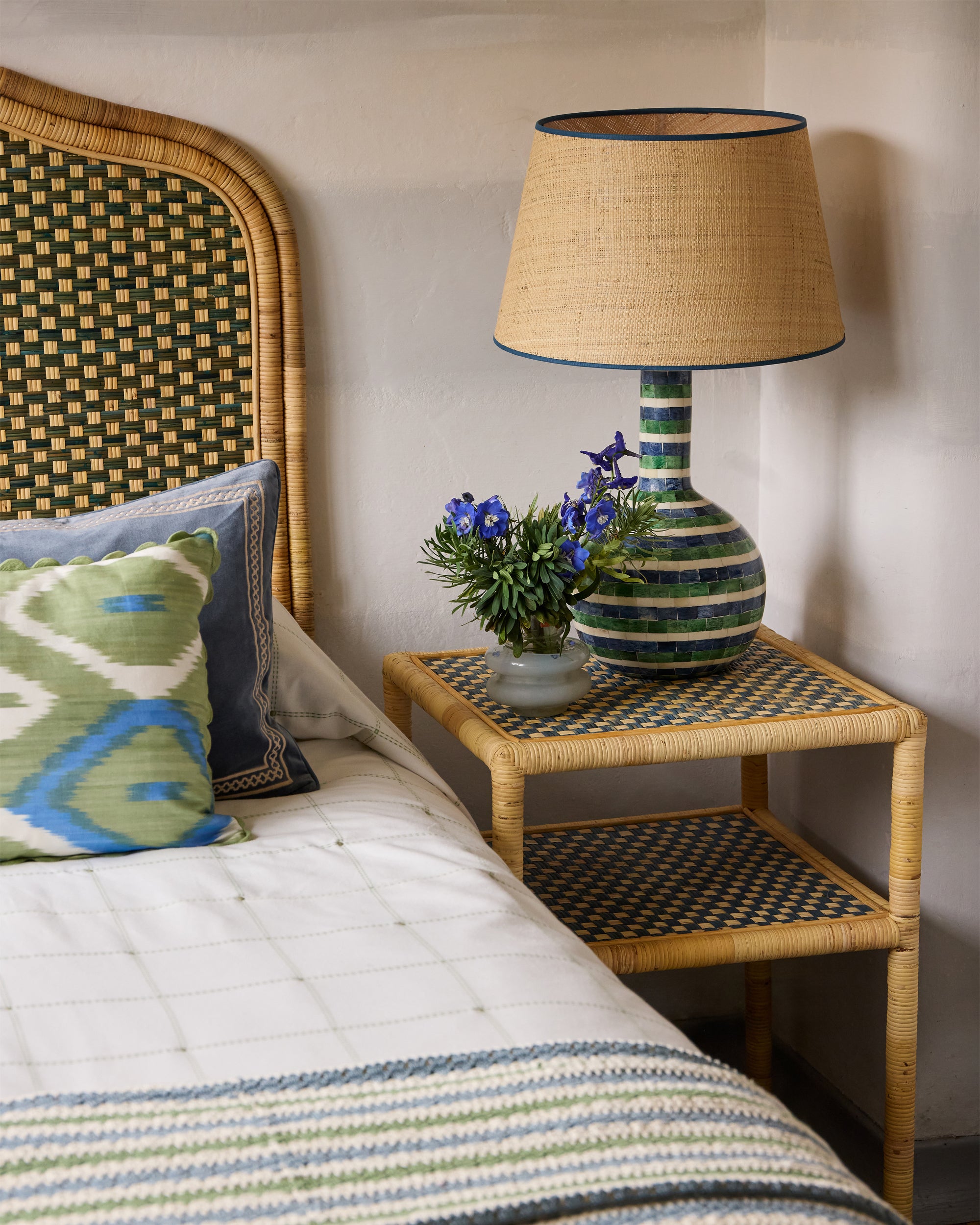 Bedside table featuring the Inlay table lamp on our Rattan side table