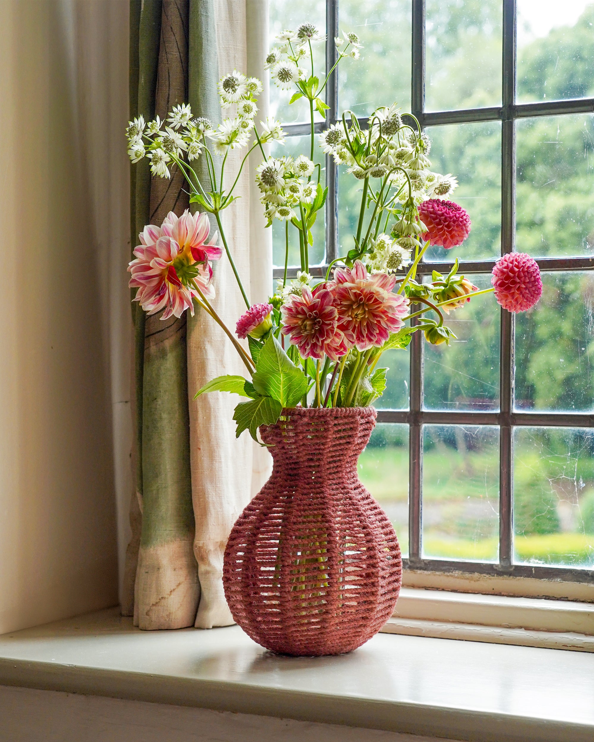 Spring summer flowers styled in Birdie Fortescue's pink string vase