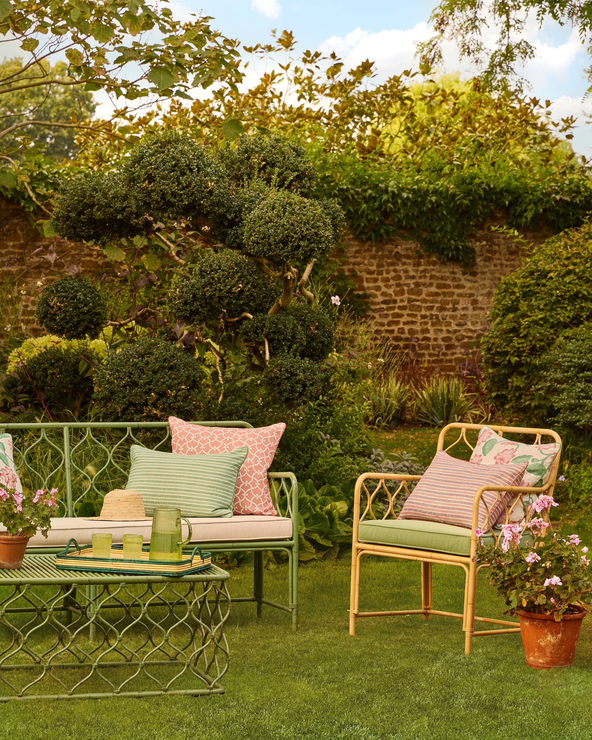 Garden setting with outdoor furniture and decorative elements