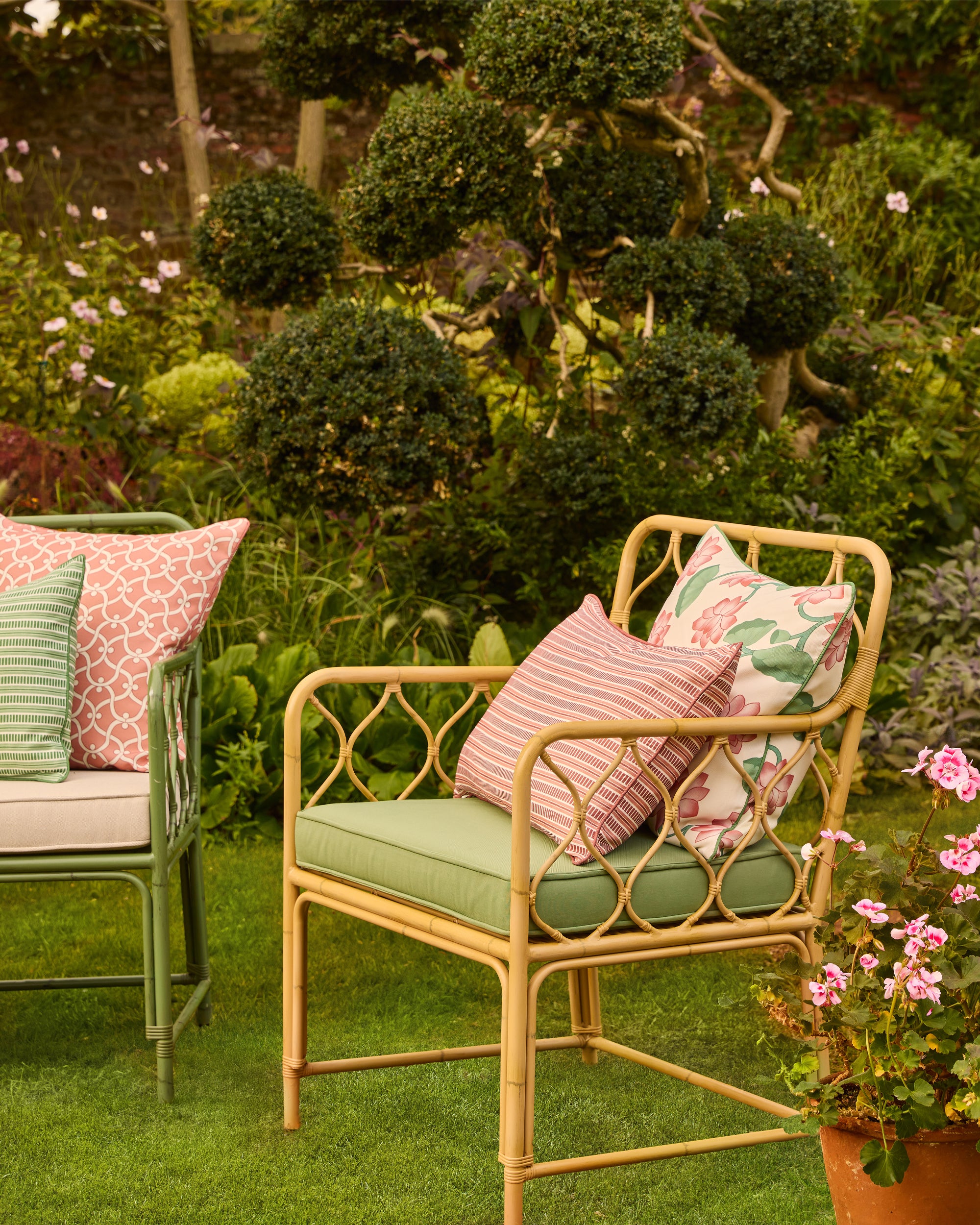 Aluminium chair with cushions in a garden setting