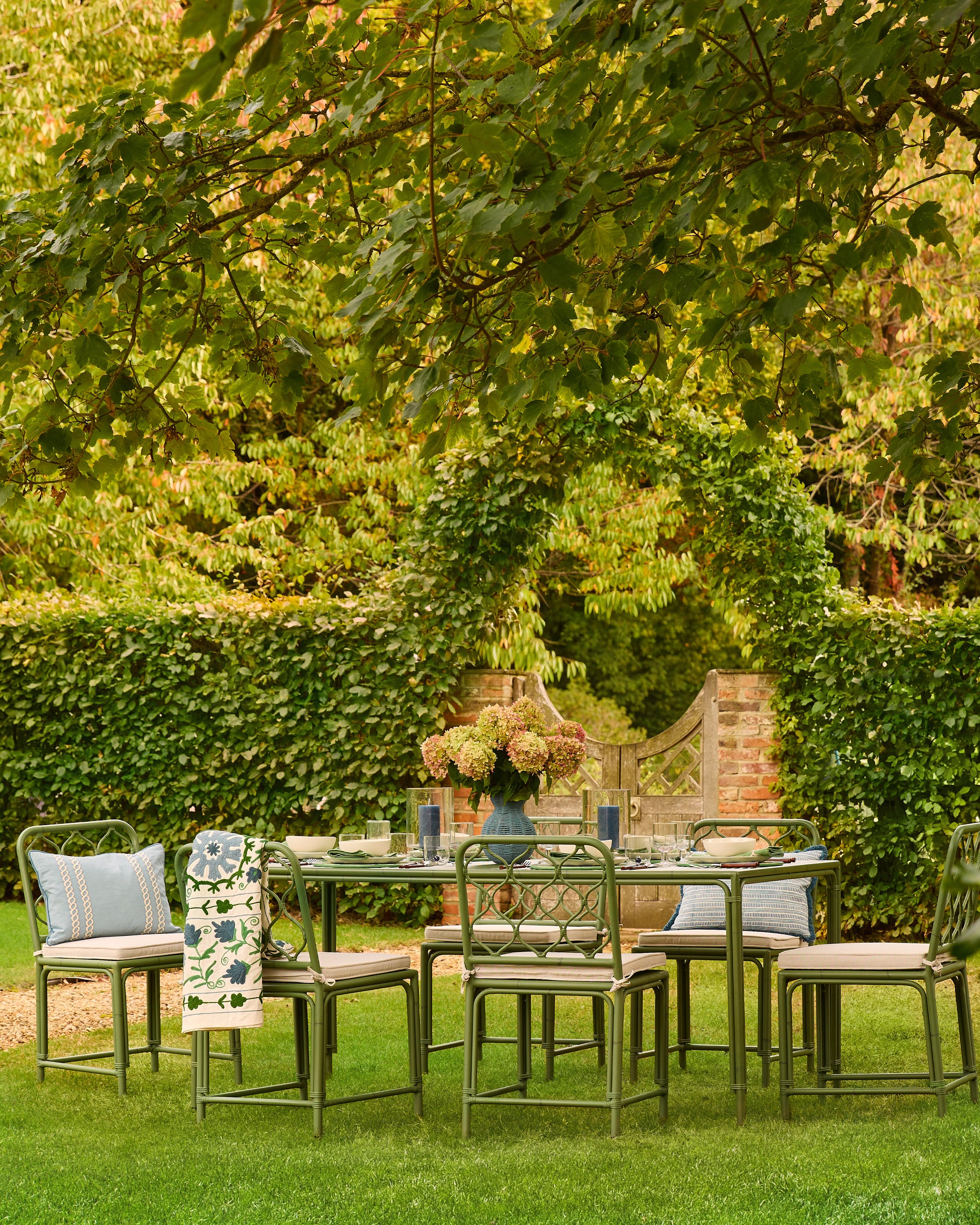 Outdoor dining set with chairs and table in a garden setting