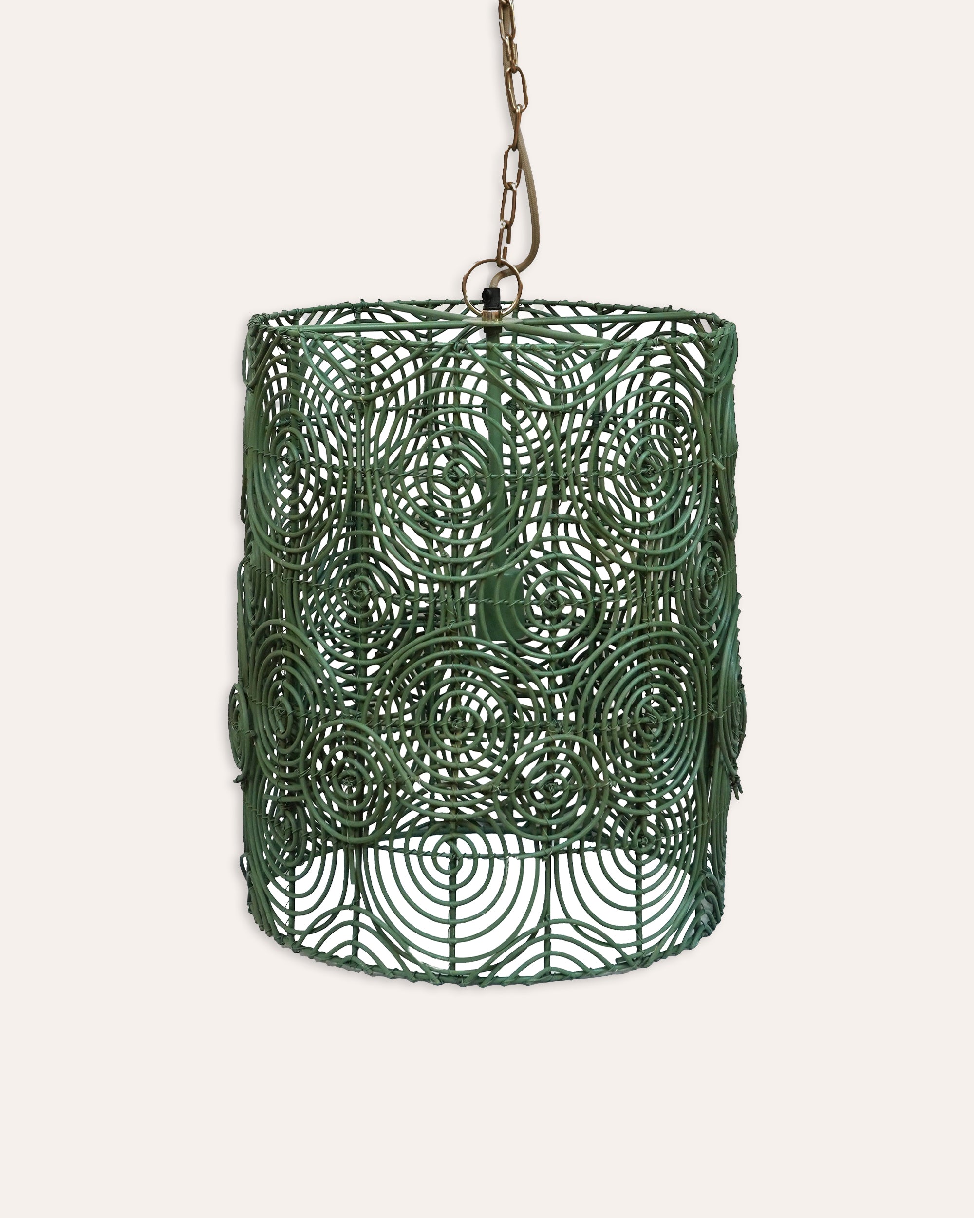 Green woven pendant light on a white background