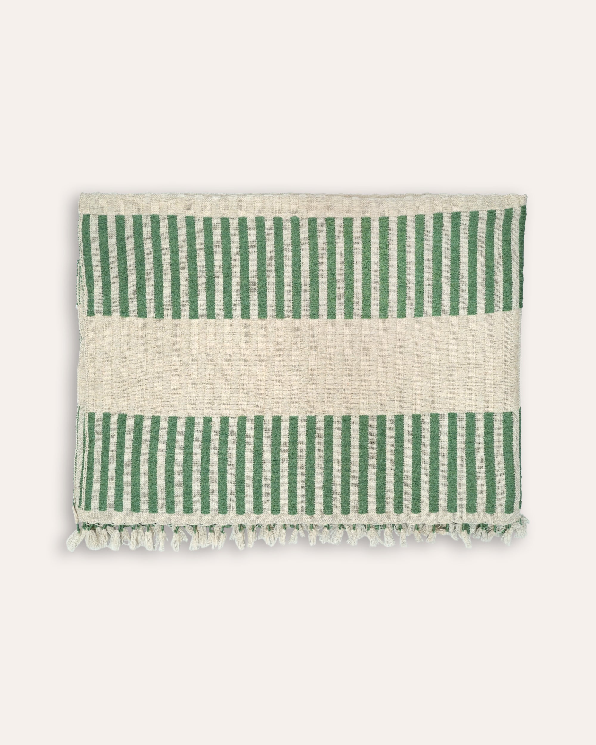 Green striped rectangular throw with green and taupe stripped pattern with a tassle border
