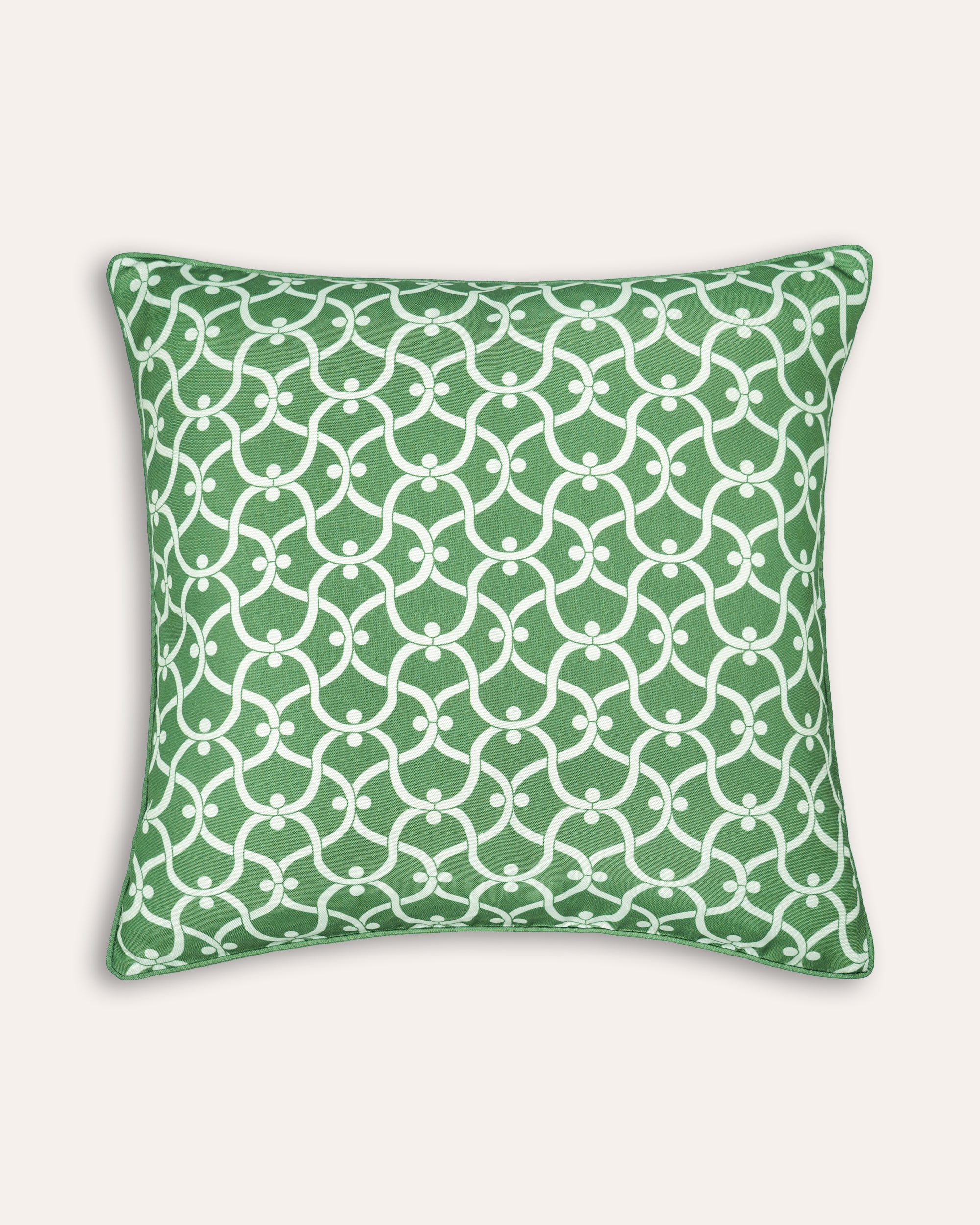 Green square outdoor cushion with white geometric pattern on a white background