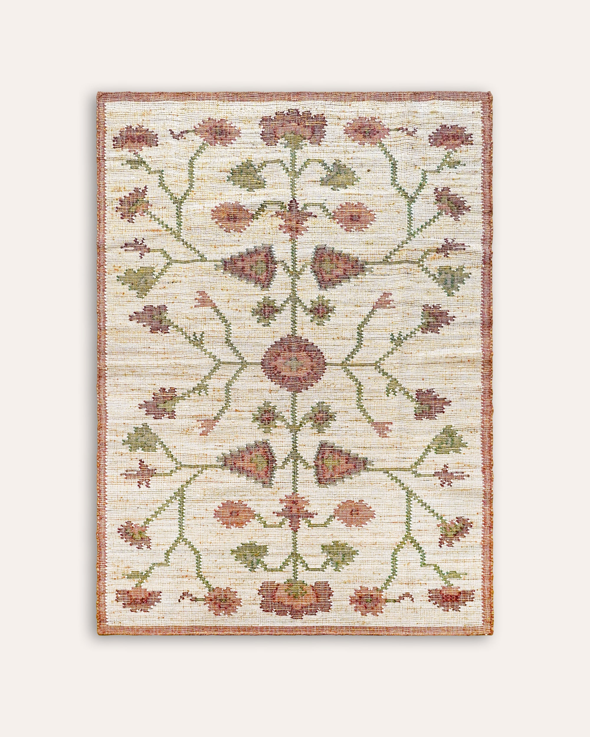 Pink and green floral Padma rectangular rug with a pink border