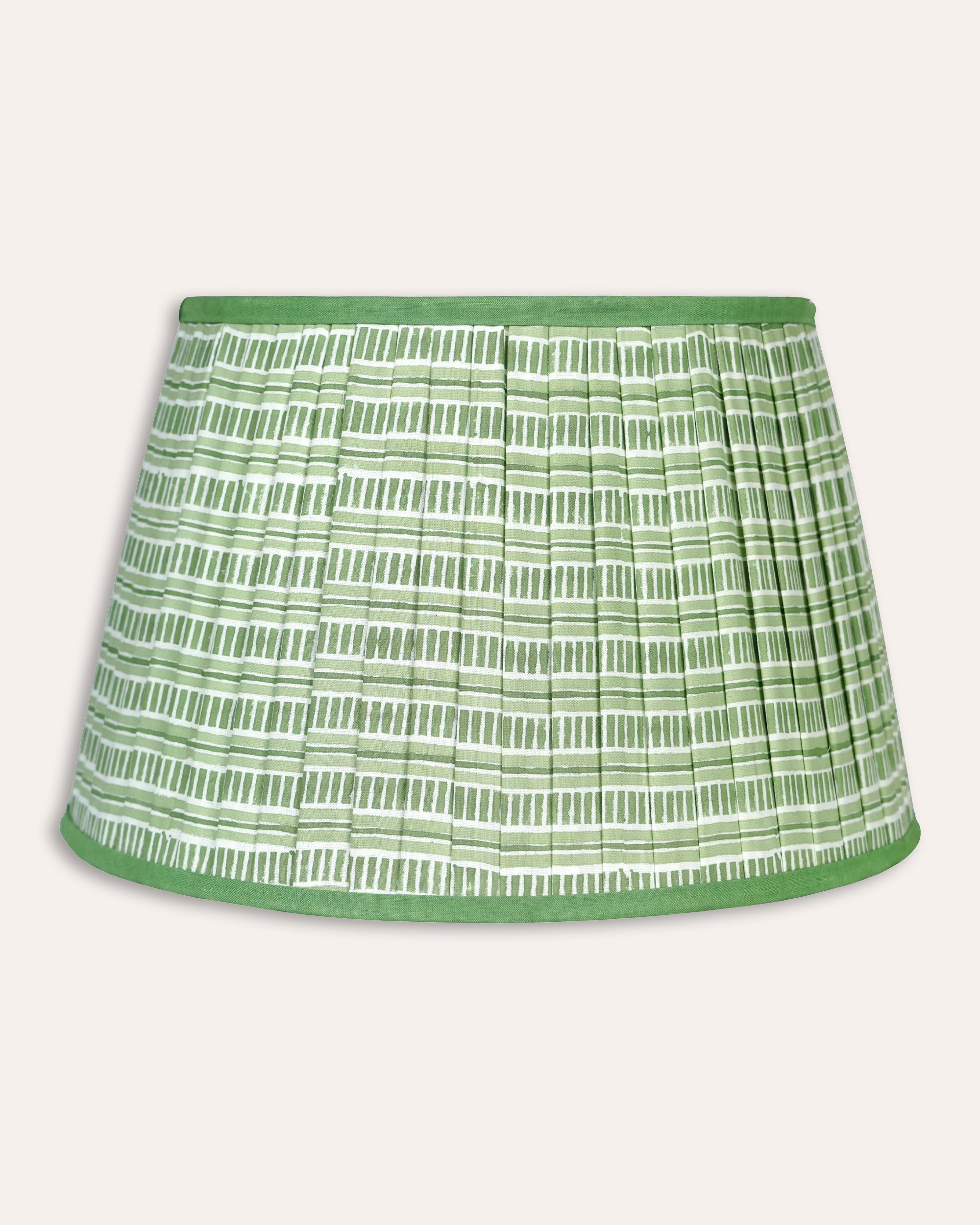 Green and white patterned lampshade on a light grey background