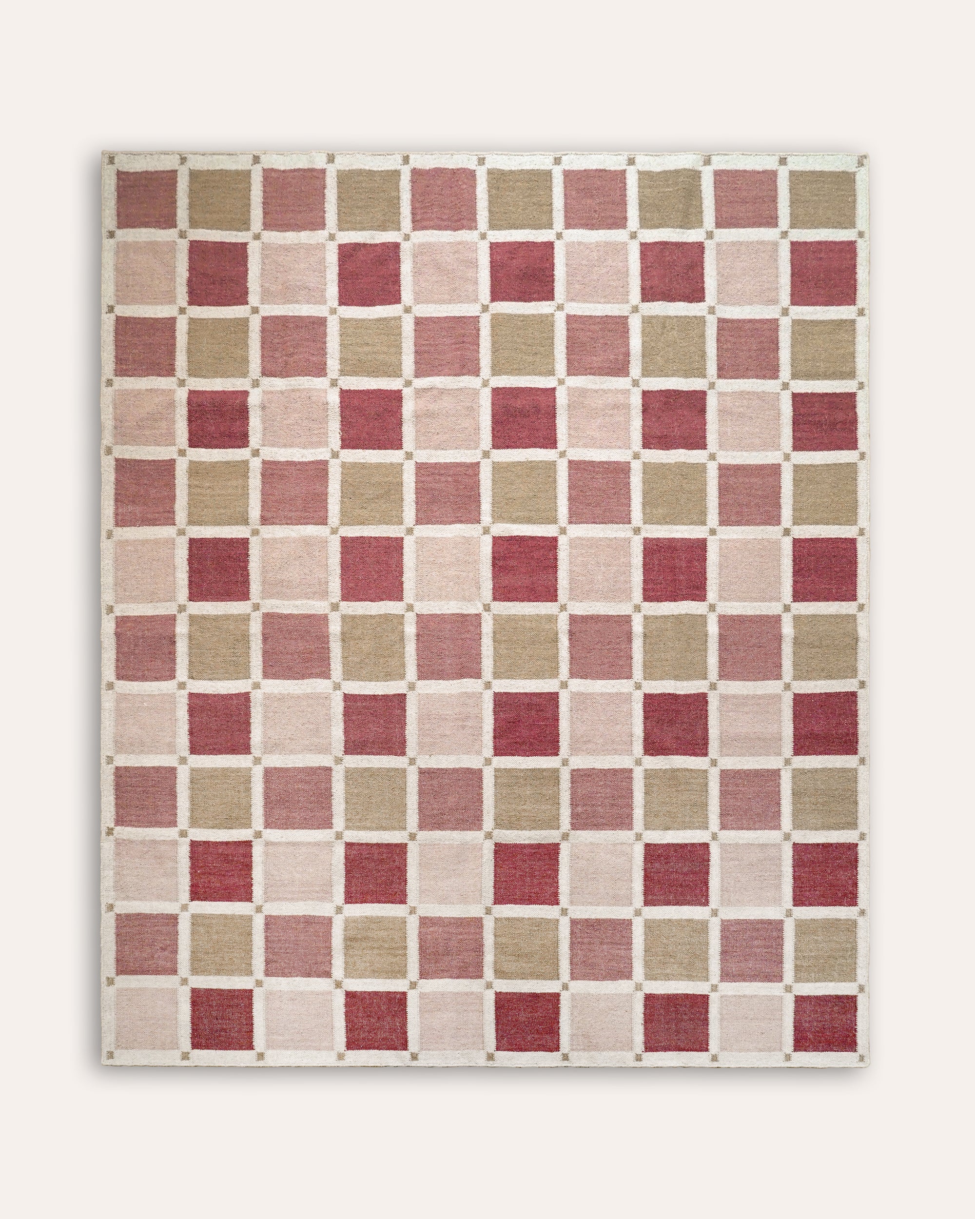 Rectangular rug with red, pink and taupe flatweave squares