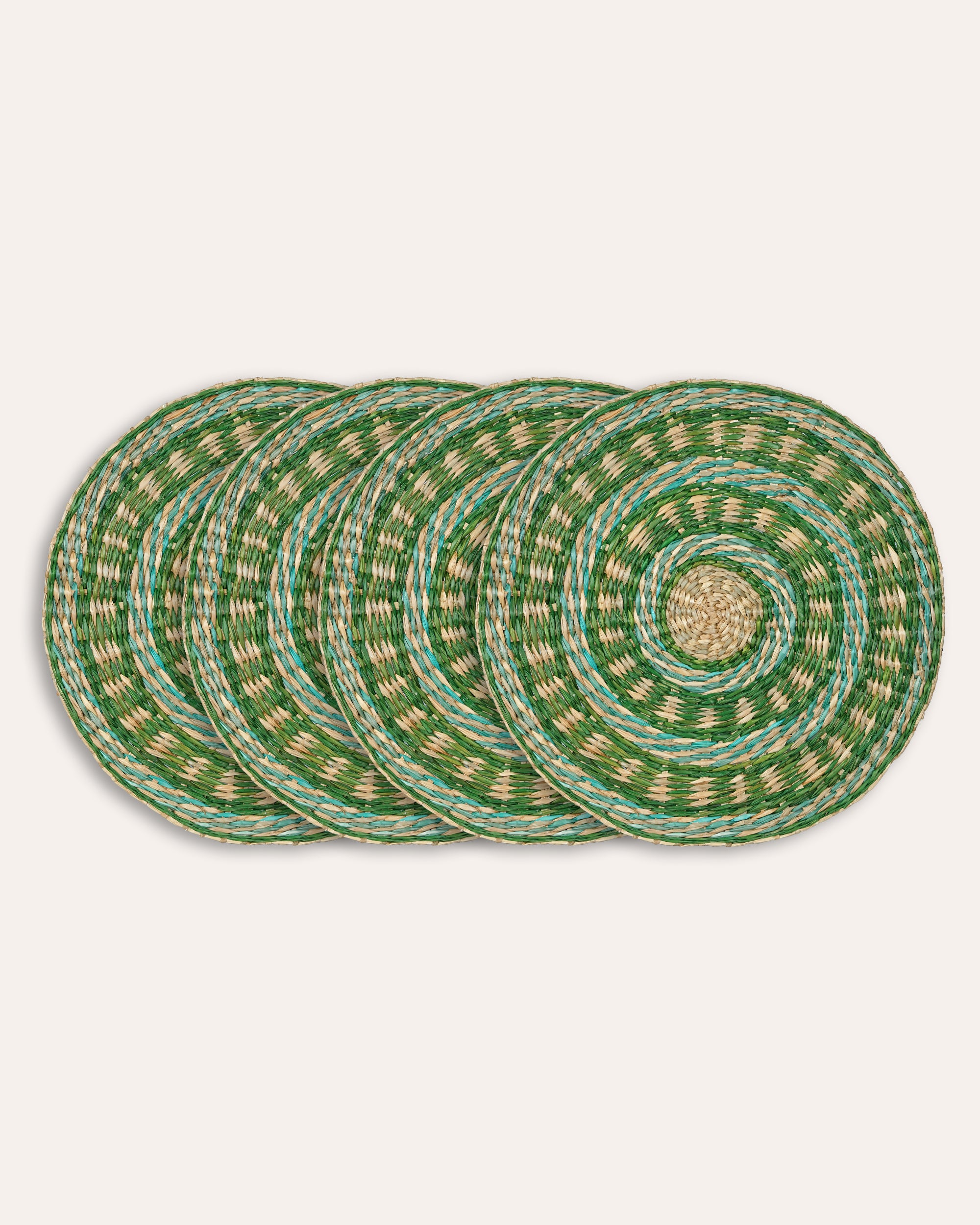 Set of green woven placemats on a white background