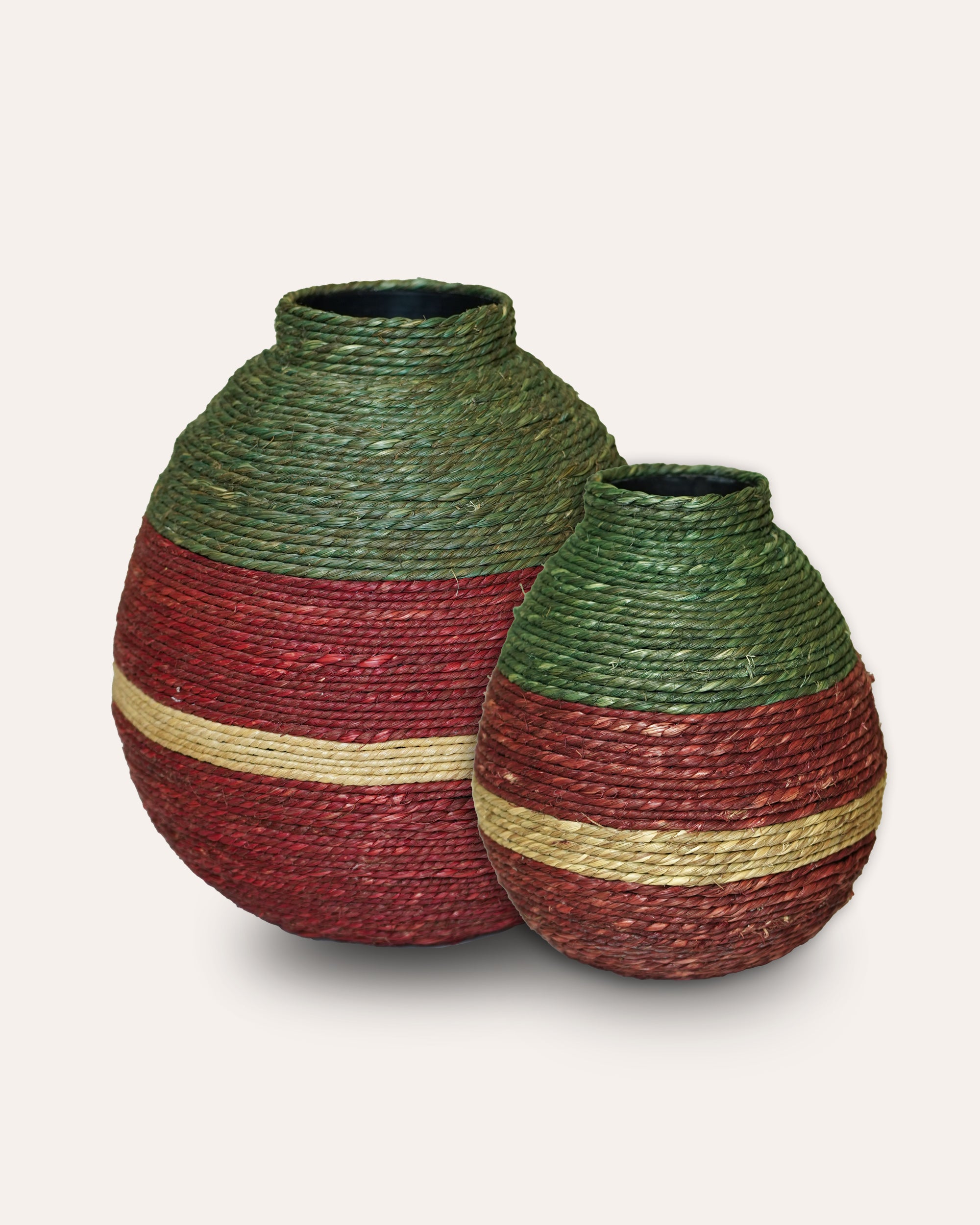 Two woven vases with green and red stripes on a white background