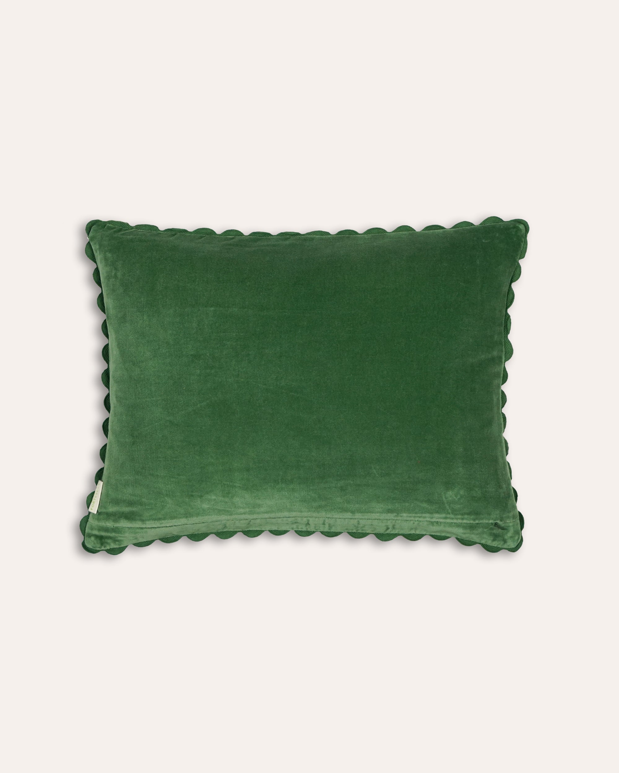 Green velvet cushion back with scalloped edge on a white background