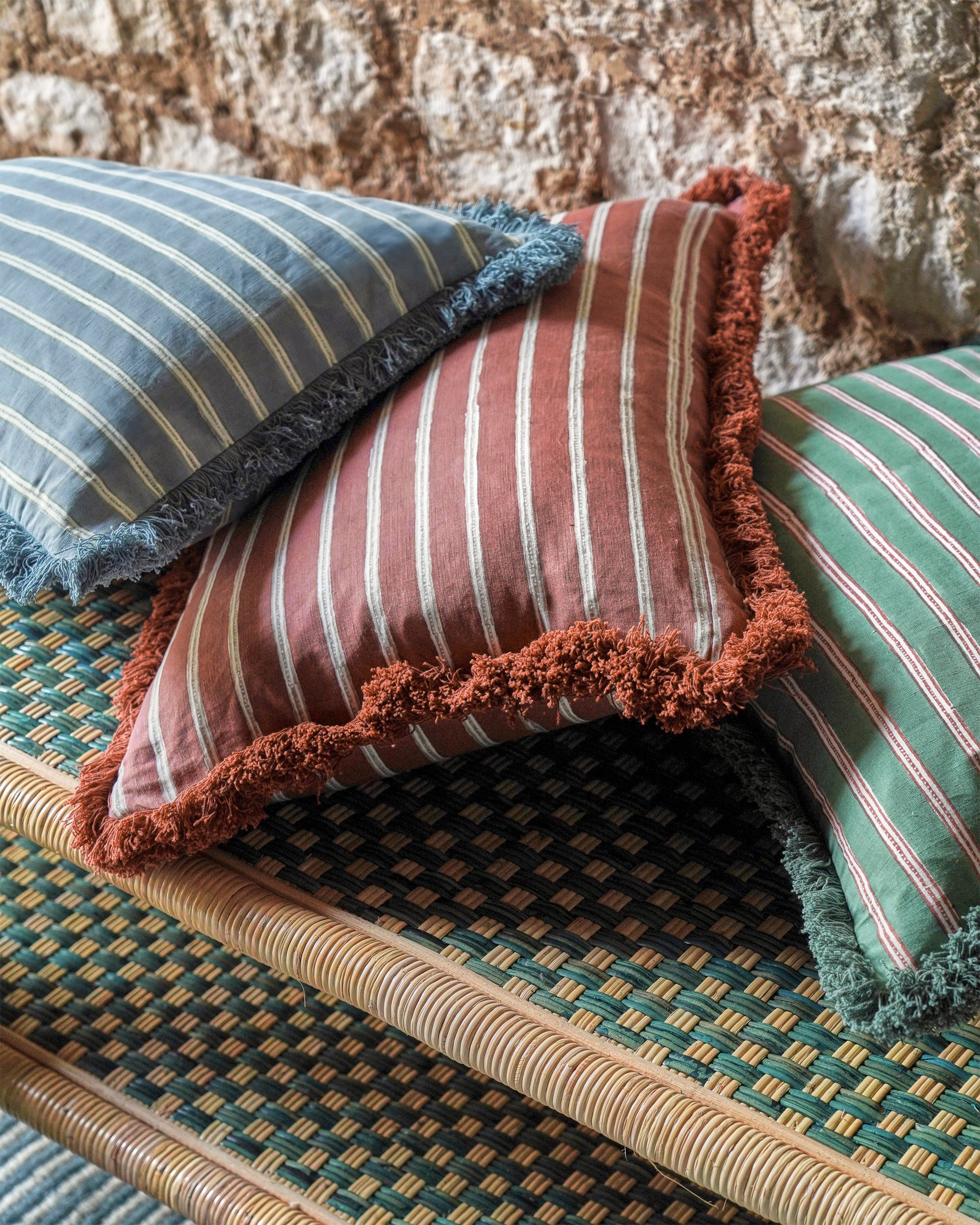 Striped cushions on a textured surface