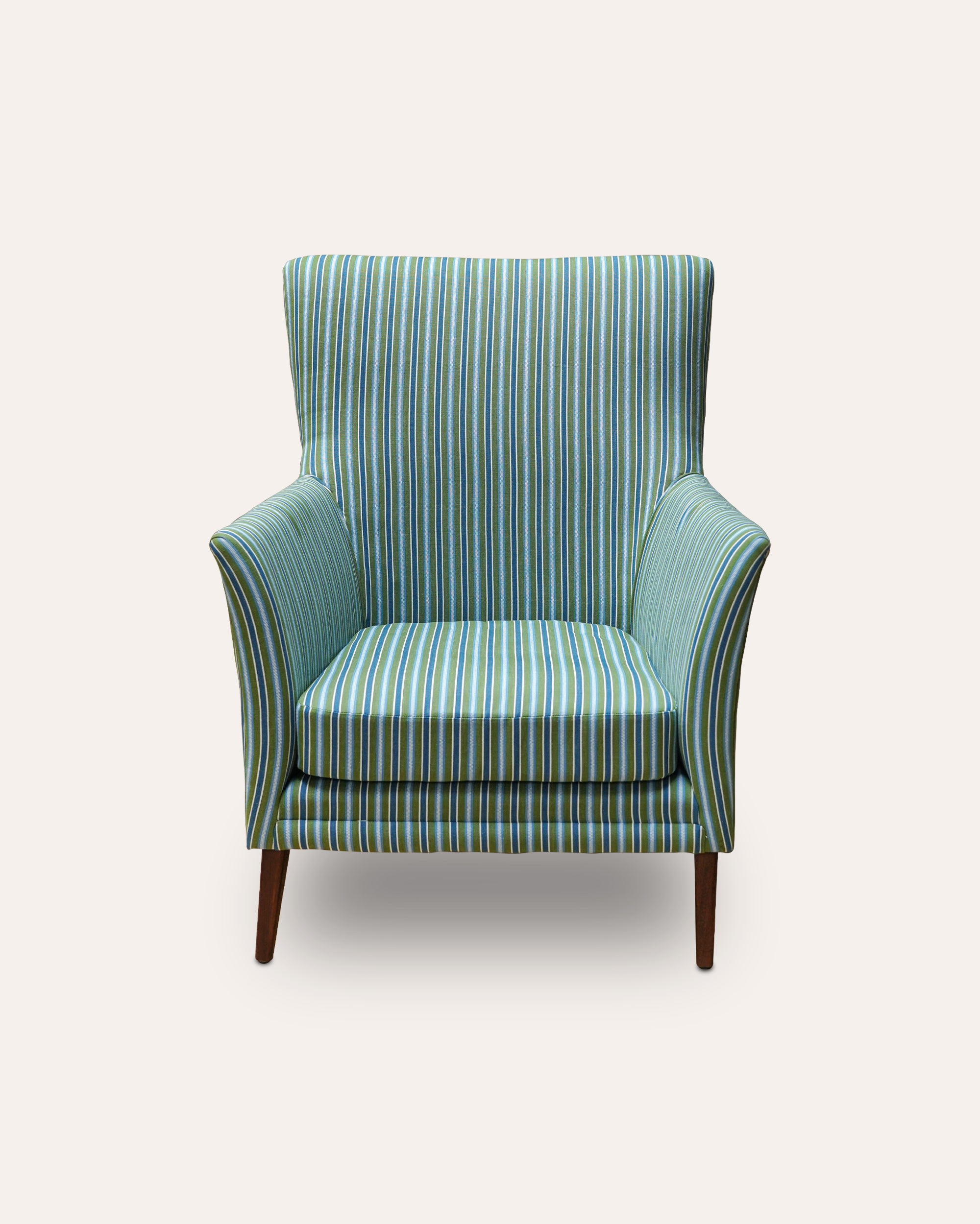 Green striped armchair on a white background