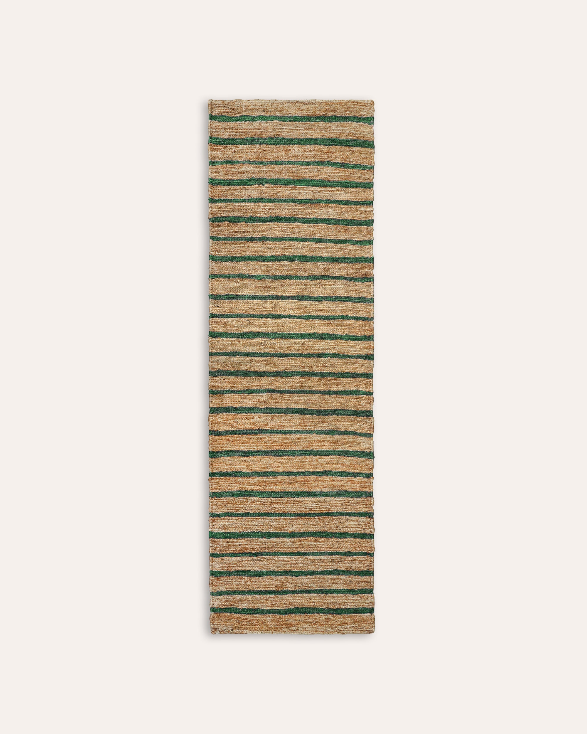Striped rug with green and beige stripes on a white background