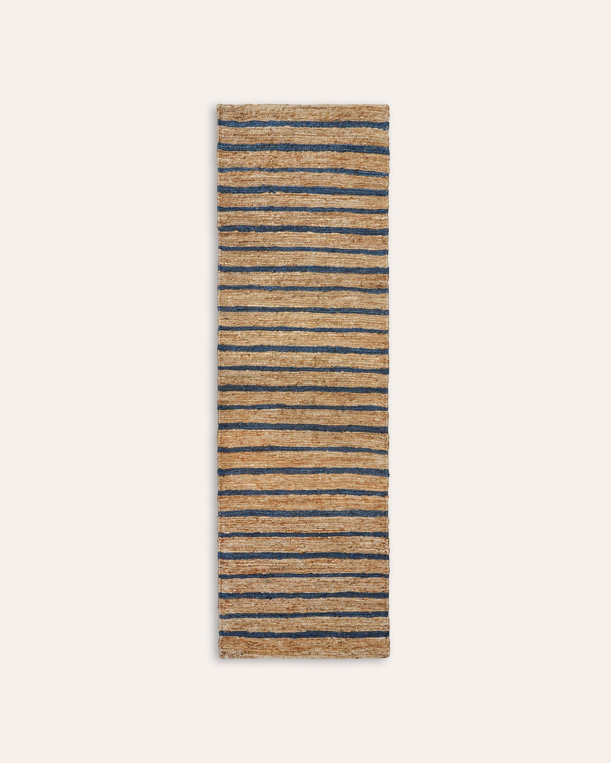 Striped rug with blue and beige stripes on a white background