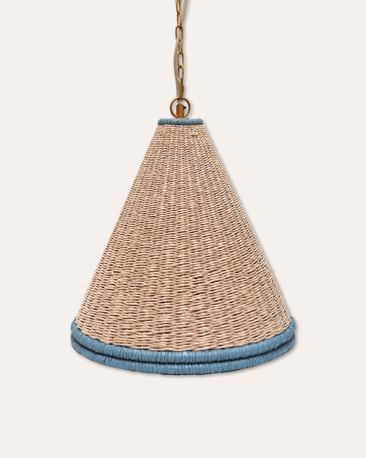 A natural woven seagrass cone pendant light shade with a light blue braided trim at the top and bottom, suspended by a brass chain against a light beige background.